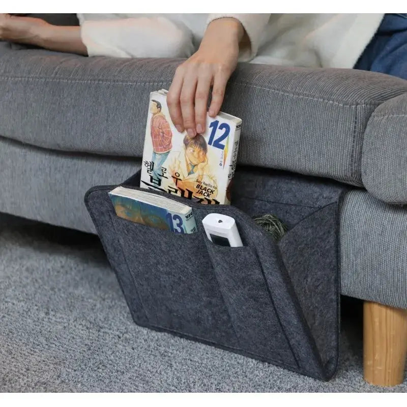 AmoorCity Felt Bedside Caddy. Felt bedside organizer with 5 pockets for storing phones, books, glasses, and other bedside essentials. Keeps items within reach while you relax in bed.