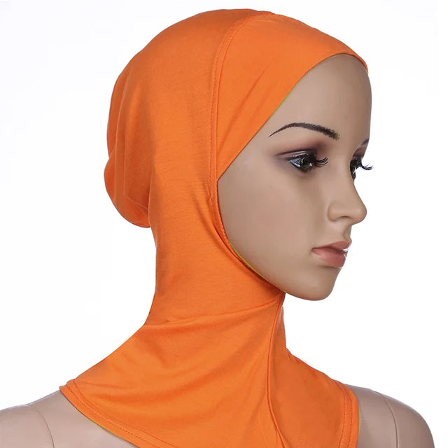 Breathable athletic underscarf hijab for women in a Orange by AmoorFemme. Made from sweat-wicking material for comfort during workouts.