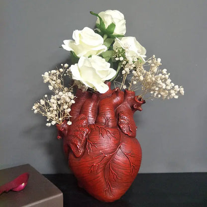 AmoorCity Heart-Shaped Table Vase. Ceramic vase in a heart shape. Perfect for adding a romantic touch to any tabletop arrangement.